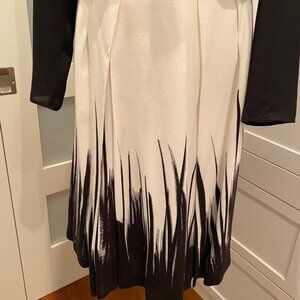 Pink Tartan black & white fully lined skirt with pockets. Size 8.
